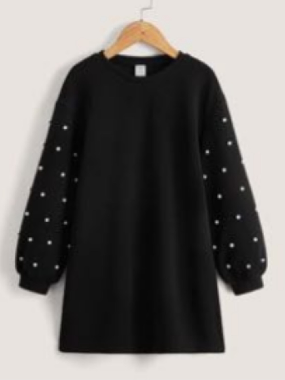 Little black dress with pearl studded sleeves